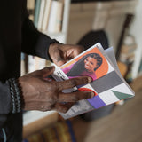Close-up of a person holding Build It Boldly by Dr. Kimberly McGlonn, showing the author photo on the back cover.