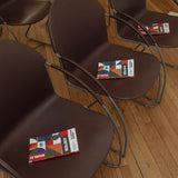 Copies of Build It Boldly by Dr. Kimberly McGlonn placed on chairs for a leadership event or book talk.