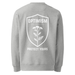 Back view of heather gray Build It Boldly crewneck sweatshirt with white “Optimism Protect Yours” shield graphic on a plain background.