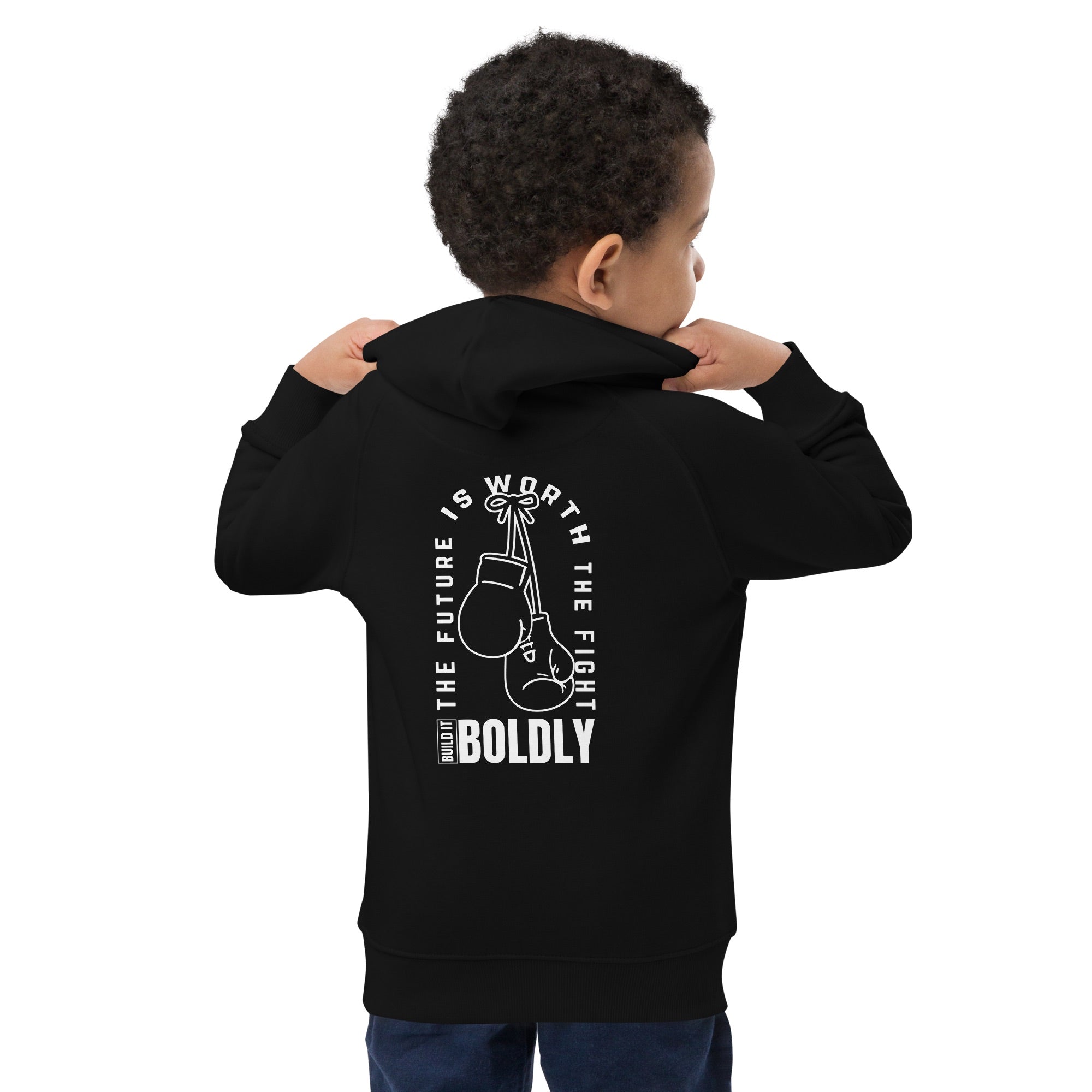 Back view of a child wearing a black Build It Boldly kids hoodie with boxing gloves graphic and the phrase “The Future Is Worth the Fight.”