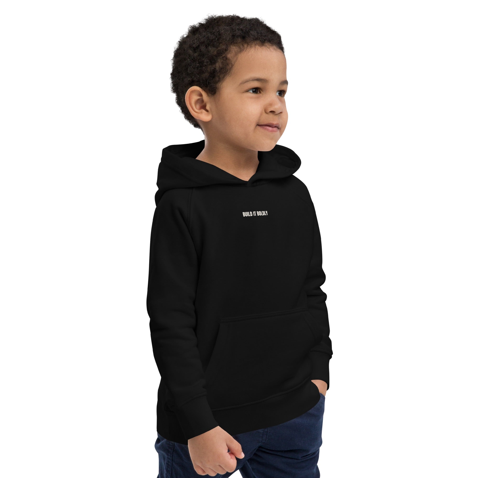 Child wearing a black Build It Boldly kids hoodie with small white chest logo, shown in right side view.