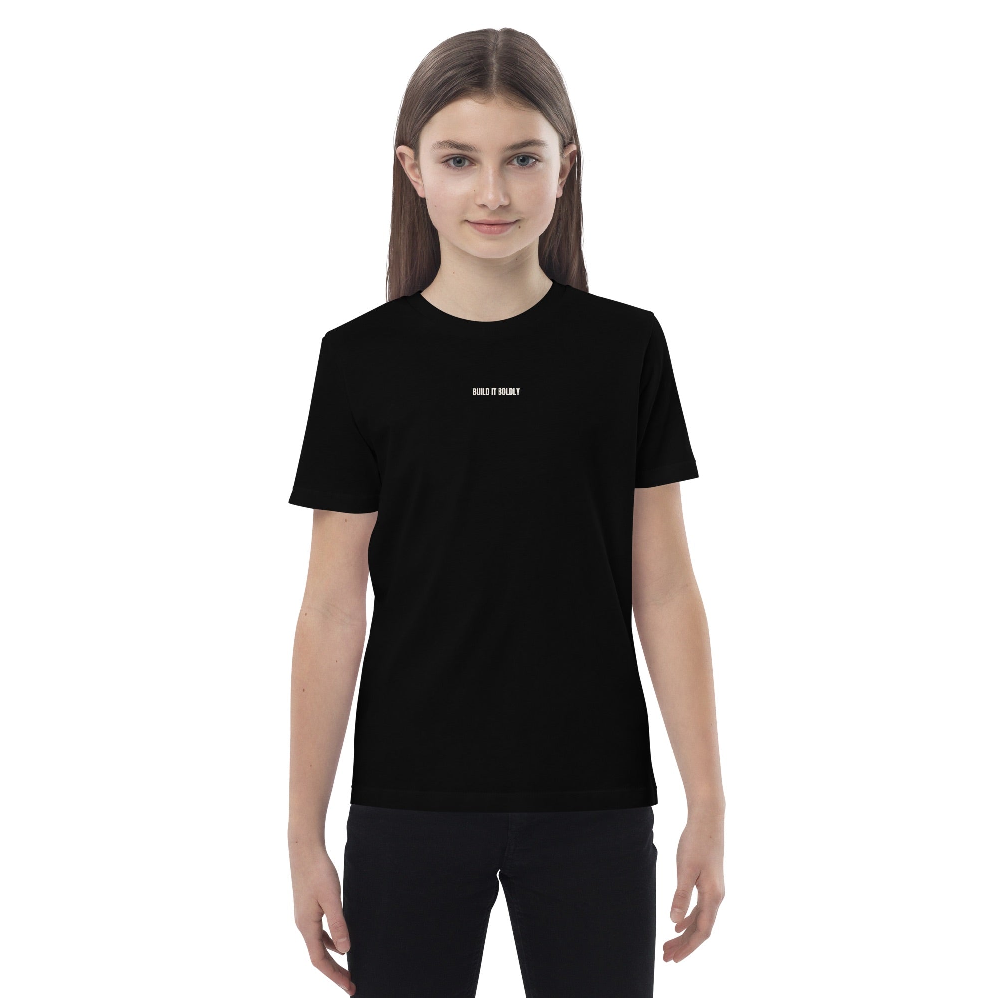 Teen wearing a black Build It Boldly organic cotton t-shirt with small white chest logo, shown in front-facing model view.