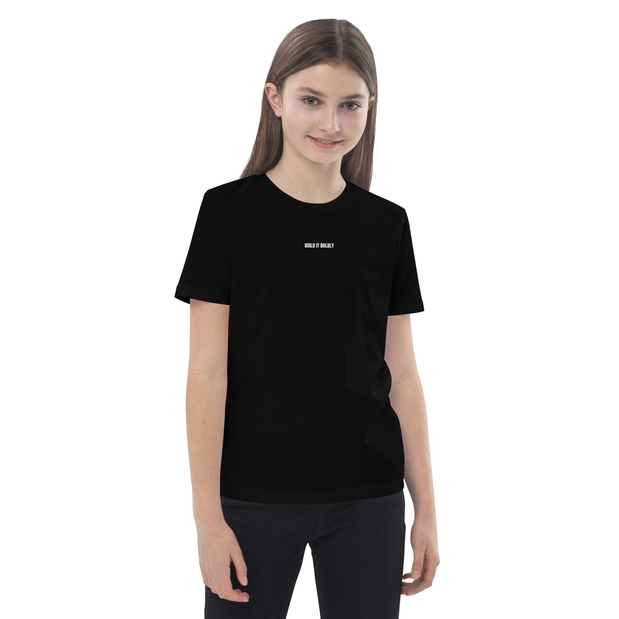 Front view of a black Build It Boldly kids organic cotton t-shirt with small white chest logo on model.