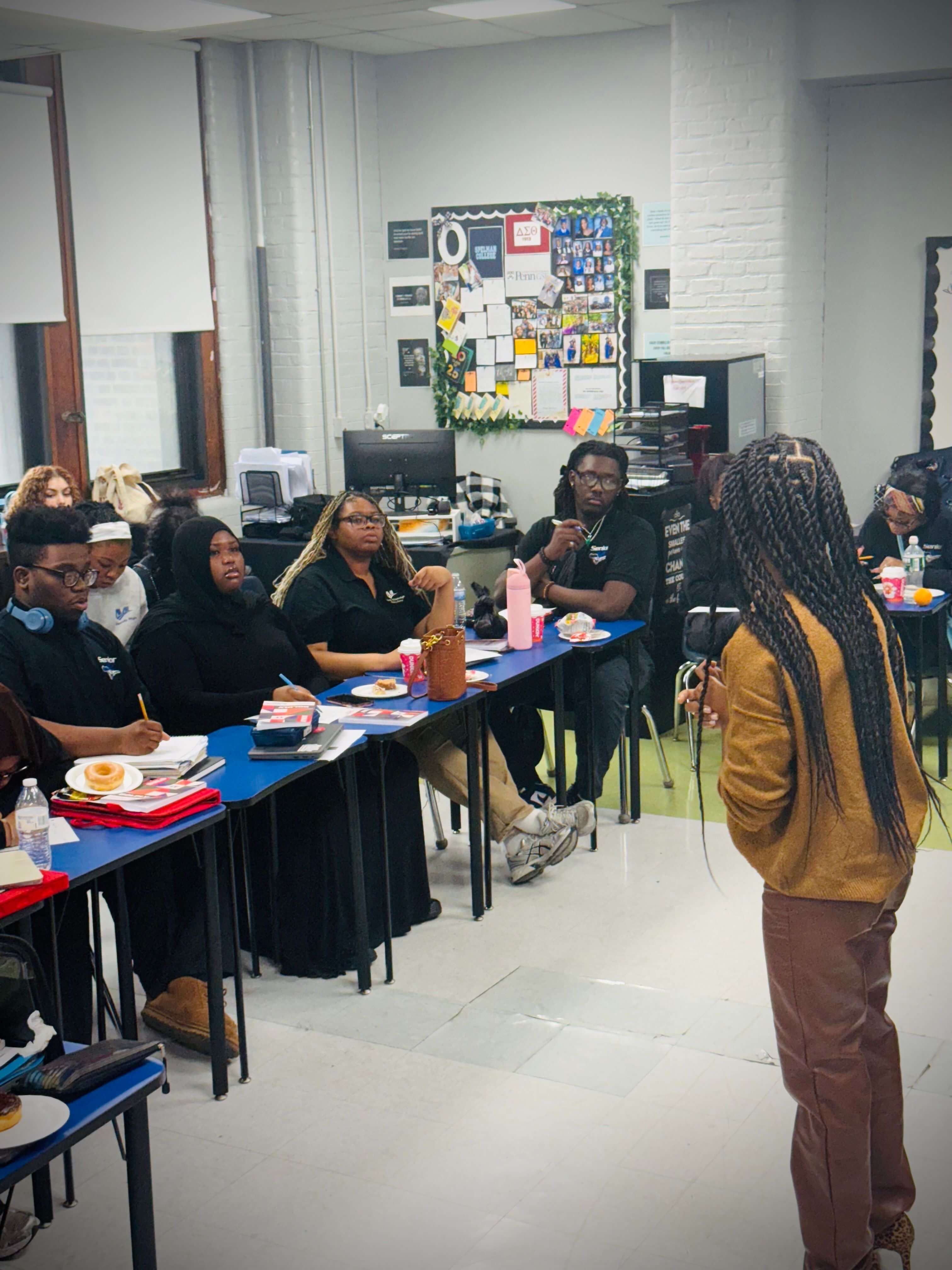 Build It Boldly facilitator leading a classroom workshop with students using The Leader’s Work books and journals.