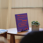 The Leader’s Work leadership journal displayed on a table, used for guided reflection and leadership practice.