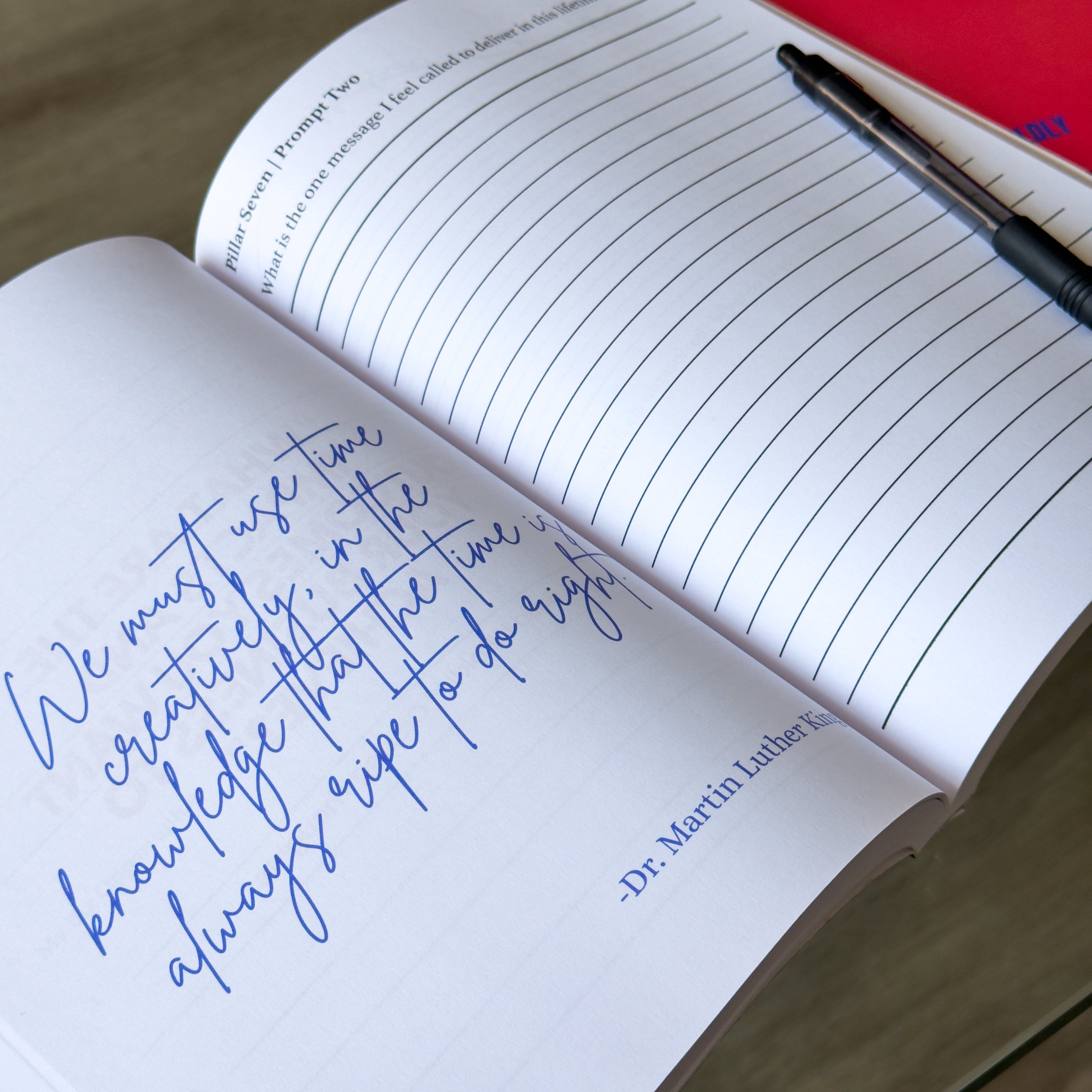 The Leader’s Work workbook open to a guided leadership reflection prompt with a handwritten quote and pen.
