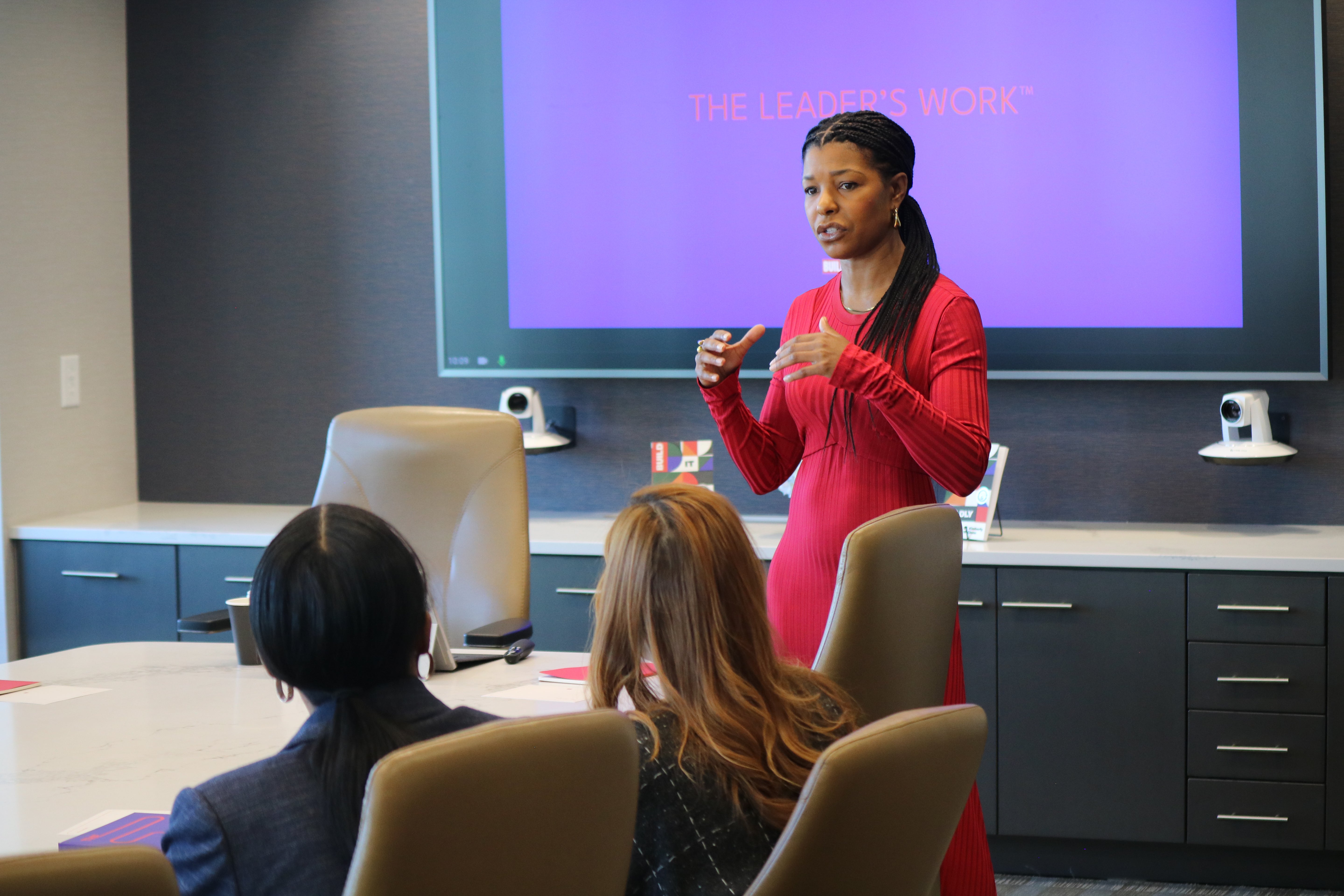 Dr. Kimberly McGlonn presenting “The Leader’s Work” leadership development framework during a corporate workshop.