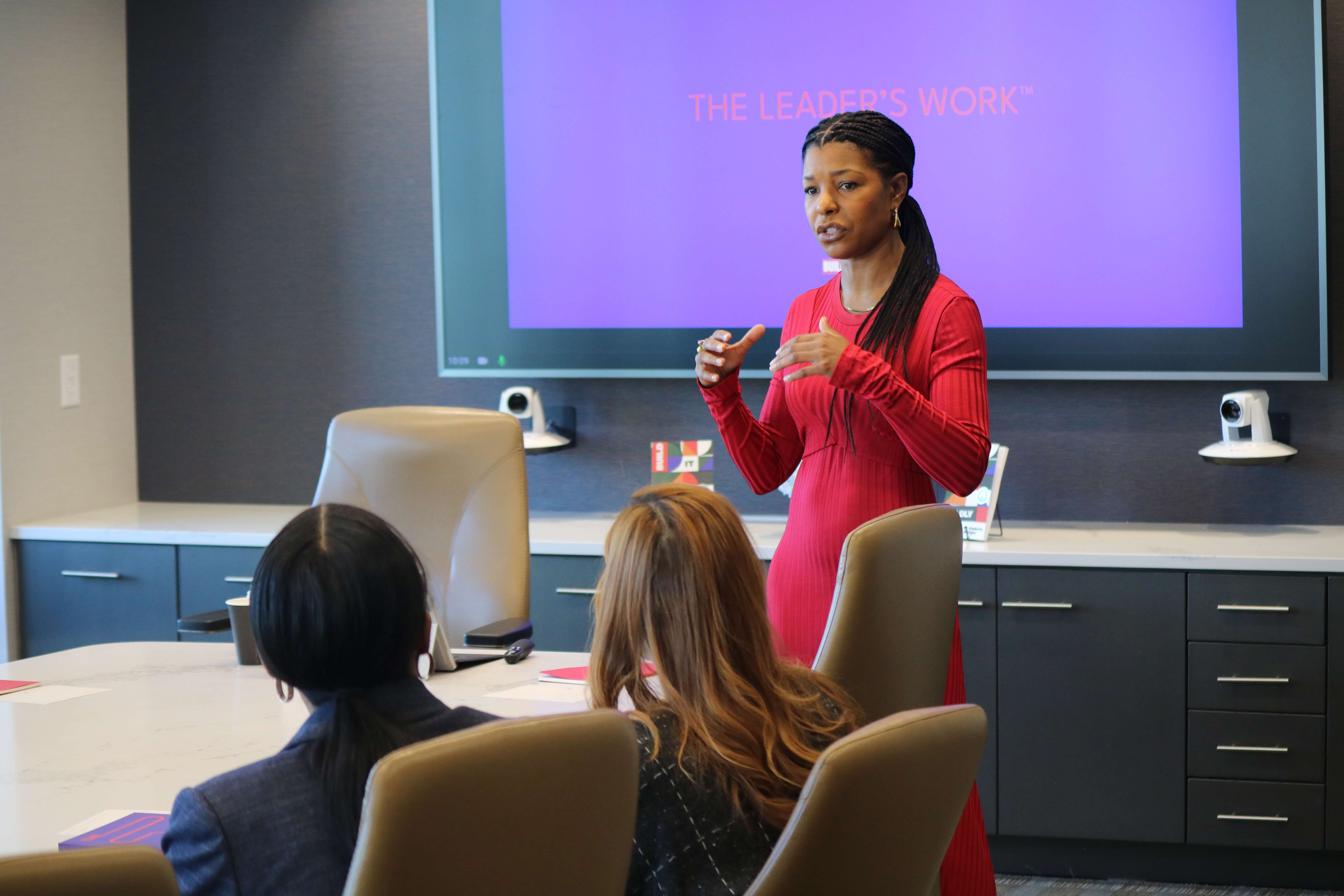 Dr. Kimberly McGlonn presenting “The Leader’s Work” leadership development framework during a corporate workshop.